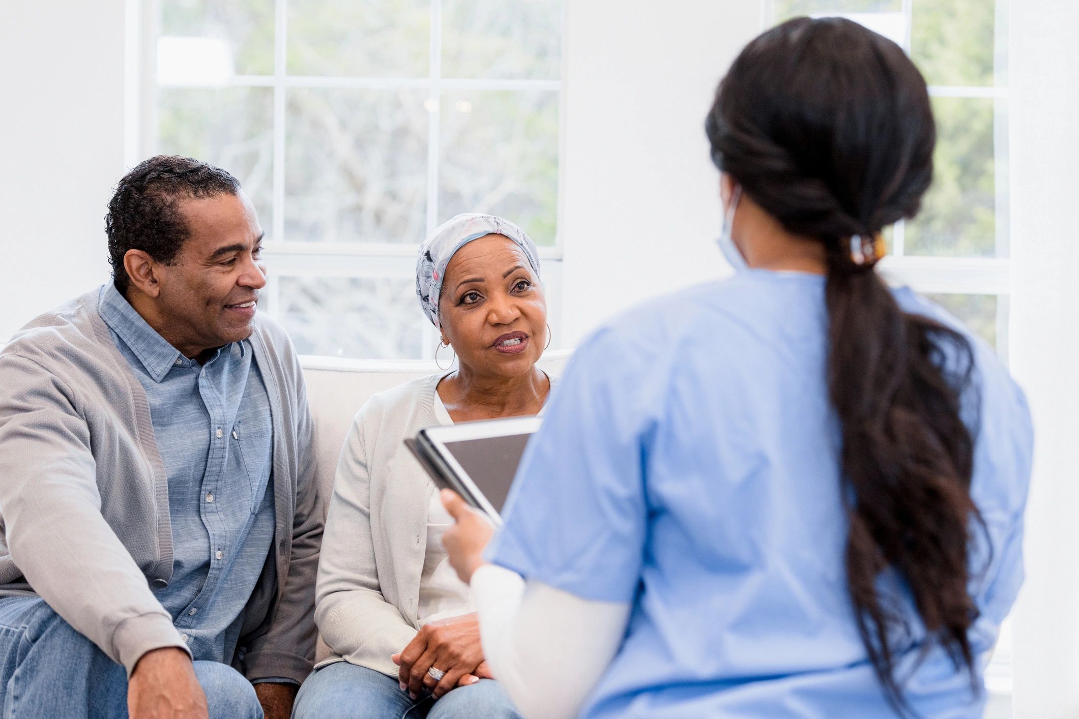 Senior couple meeting with home care nurse